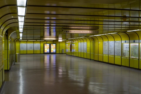 A photo of a deserted metro station in Cologne. The dominant colour is yellow.